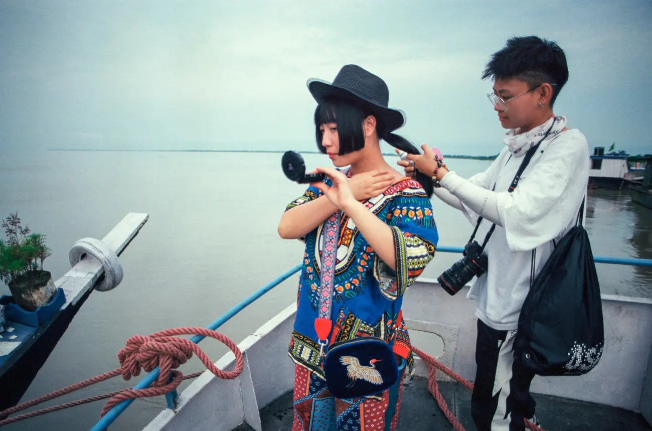 Suphy Liu and Nicole Li doing final checks before shooting on the ferry