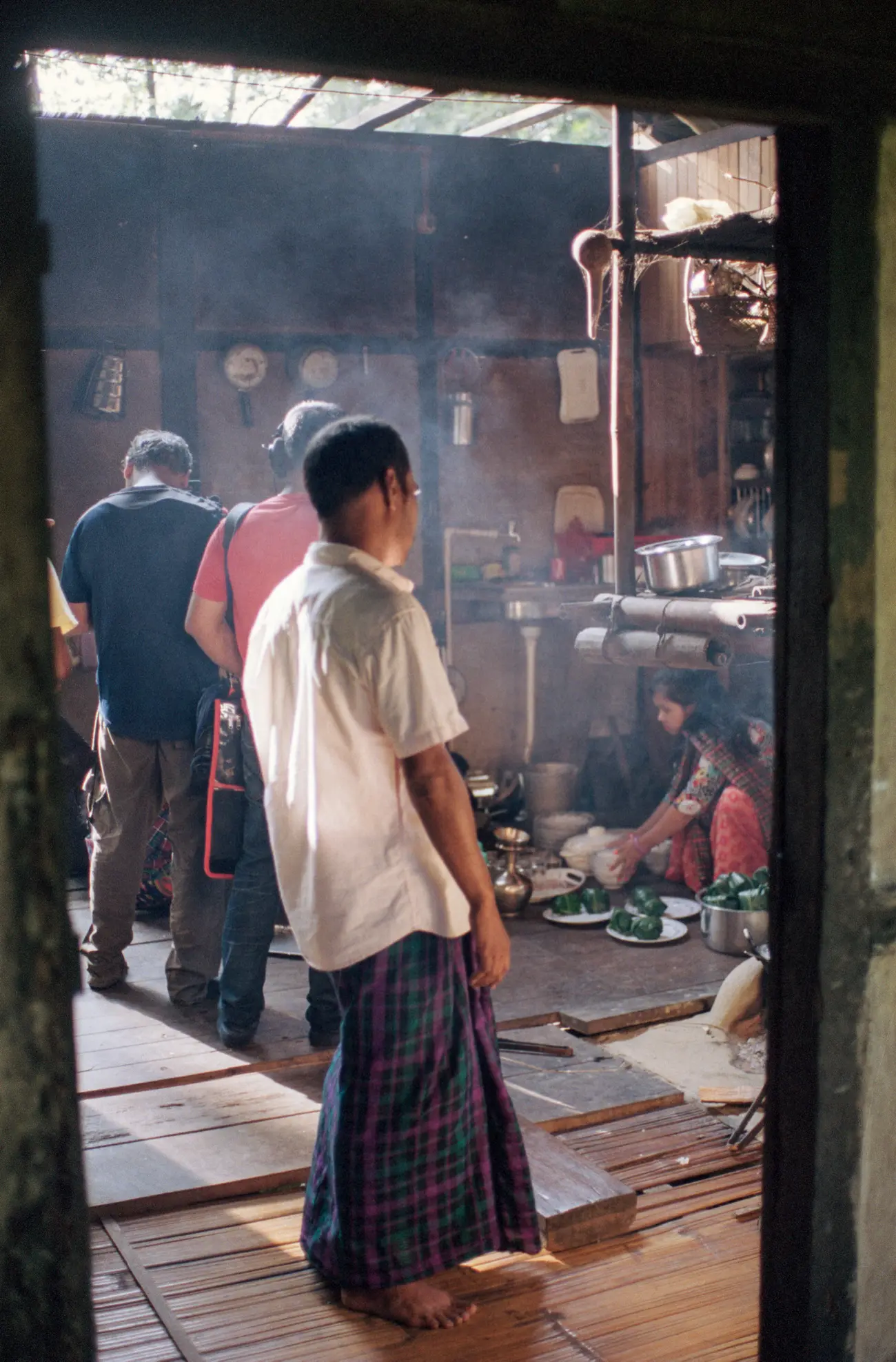 Rajesh, a Singpho village local, prepares a meal for us