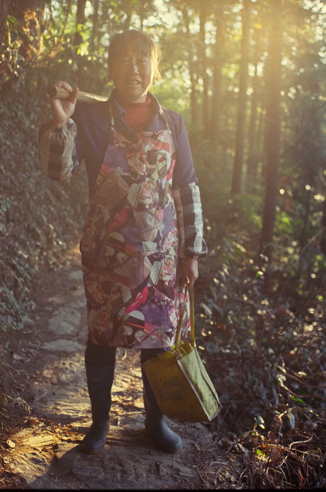 Cheerful aunty Zhan (the owner of our guesthouse) shows us how to find winter bamboo shoots in the forest.