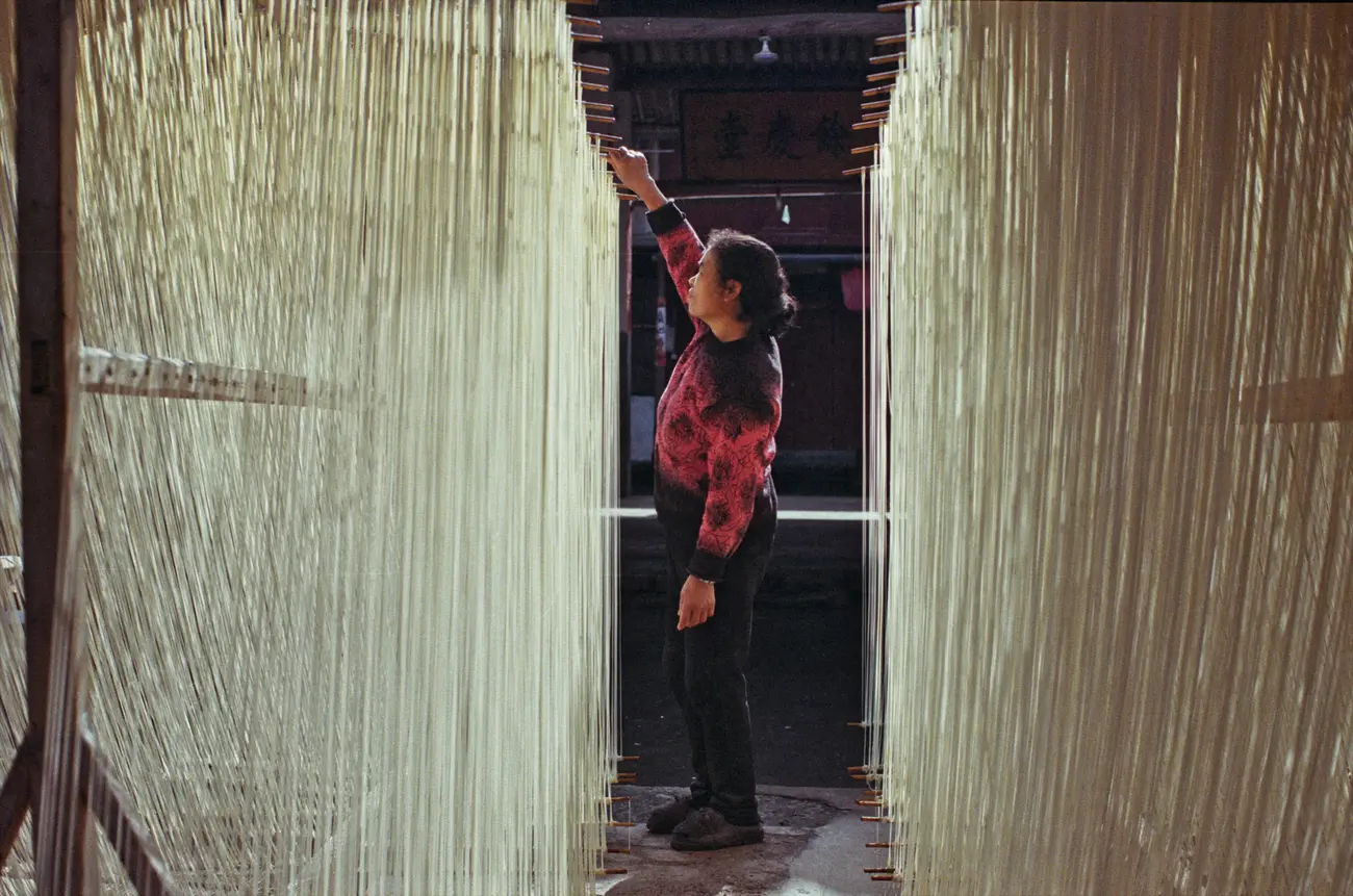 It's not unusual to see long-life noodles drying in the courtyards of Panzhoujia village.