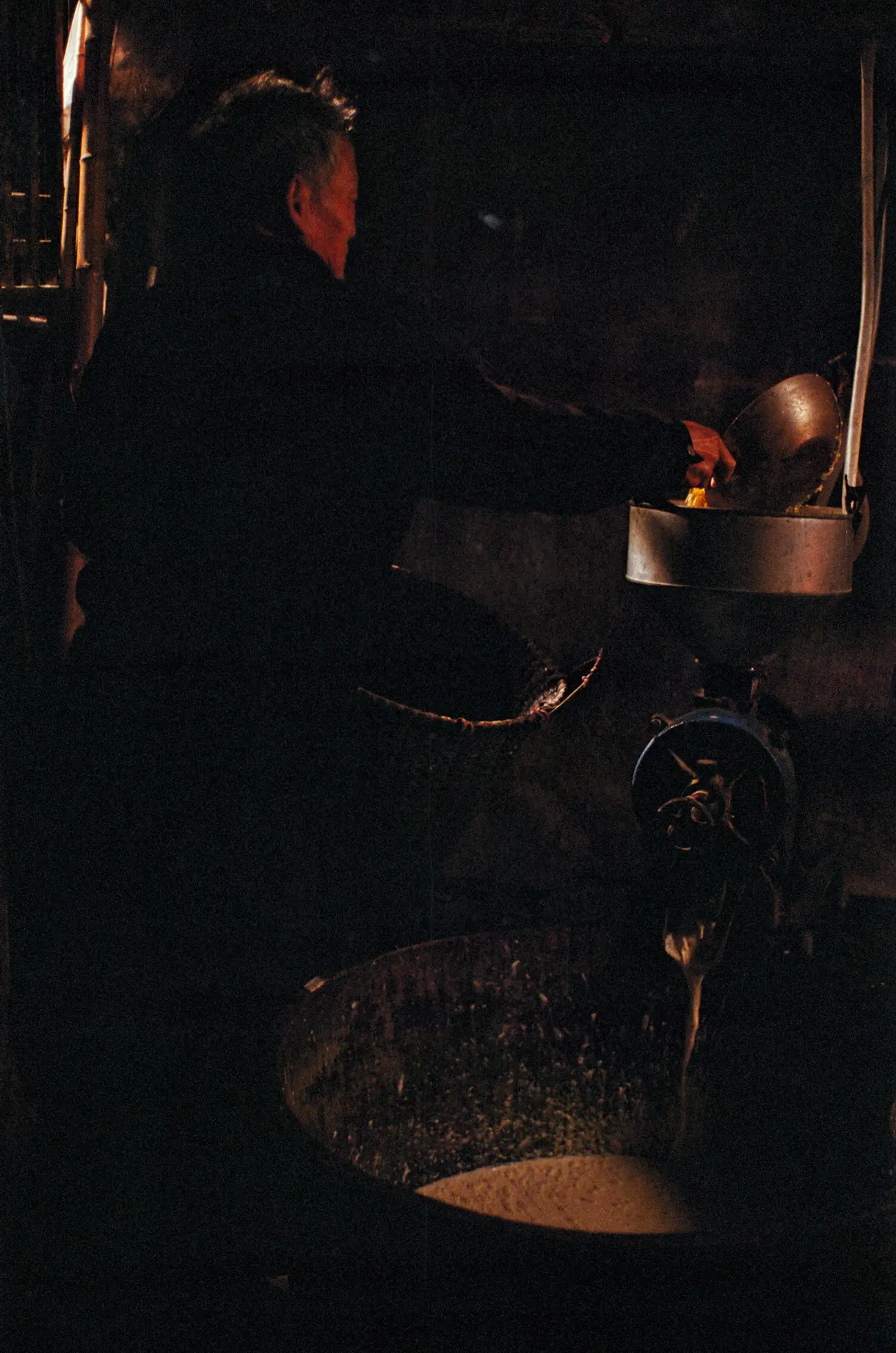 Zhang-nainai's husband grinds soya beans.