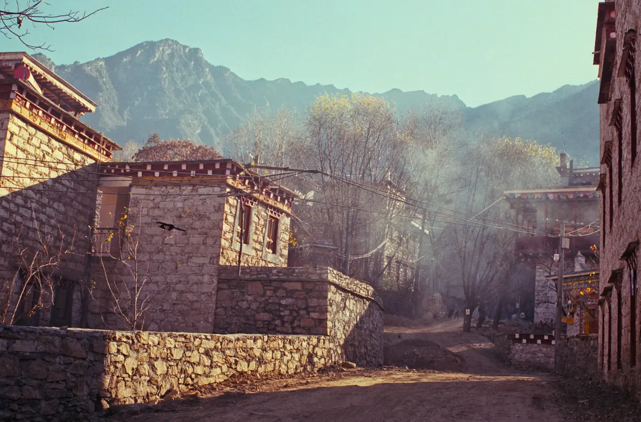 Chilly morning fog burns away as the sun rises over Zhonglu village.