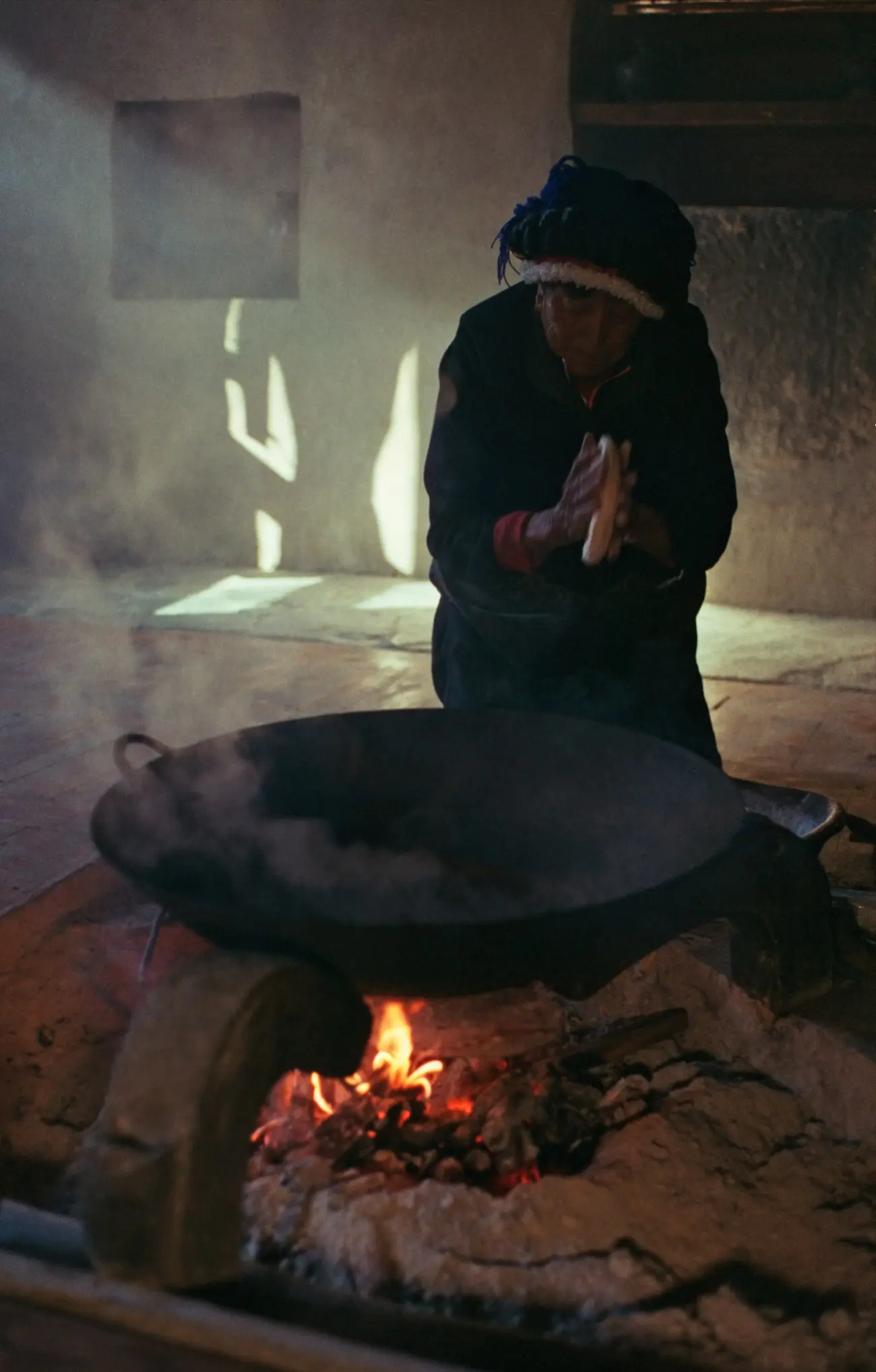 Granny Gemachu prepares a Tibetan toasted momo using the ashes of her hearth.