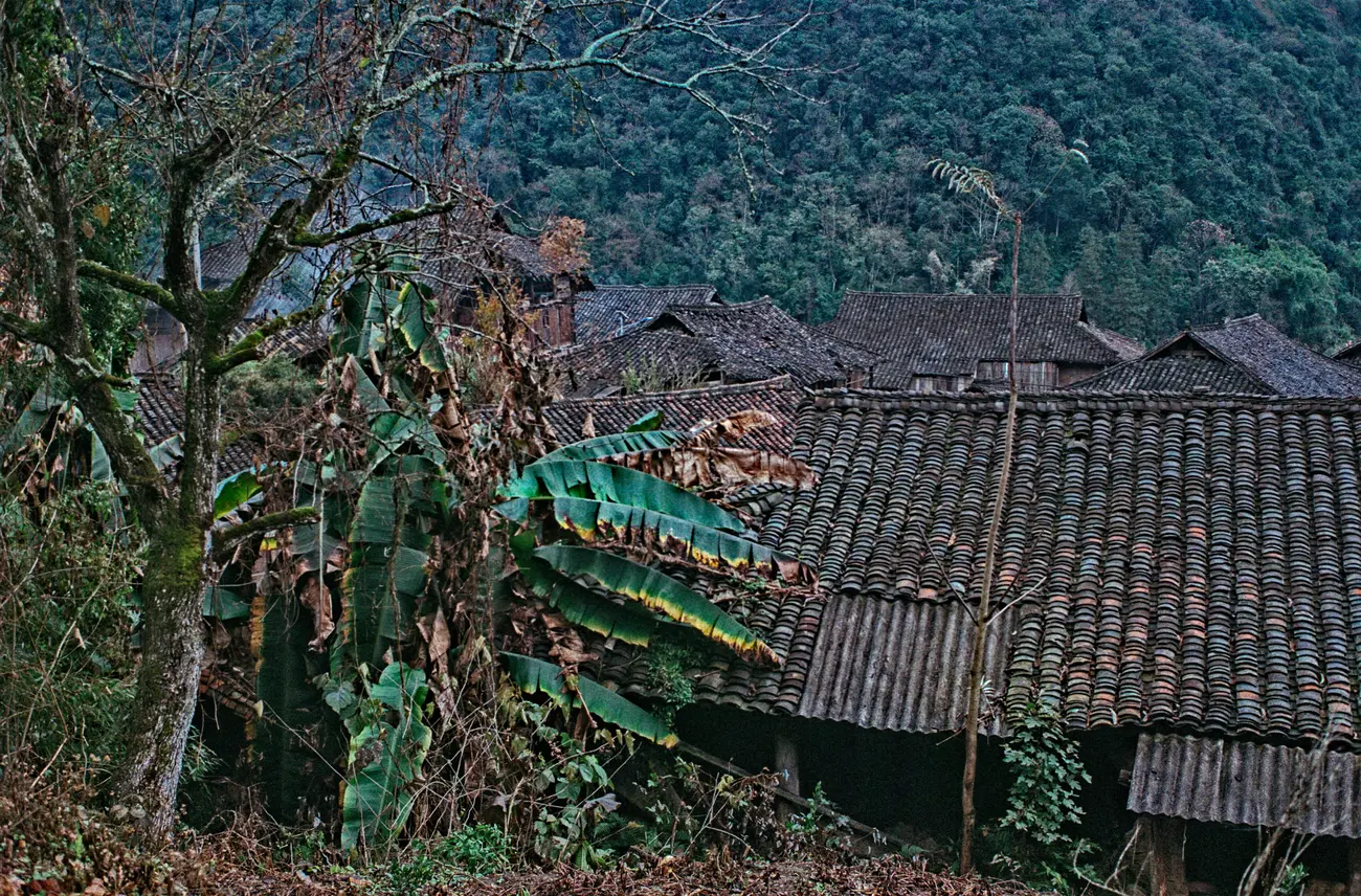O'er the rooftops of Shuipa village, surrounded by mountains.