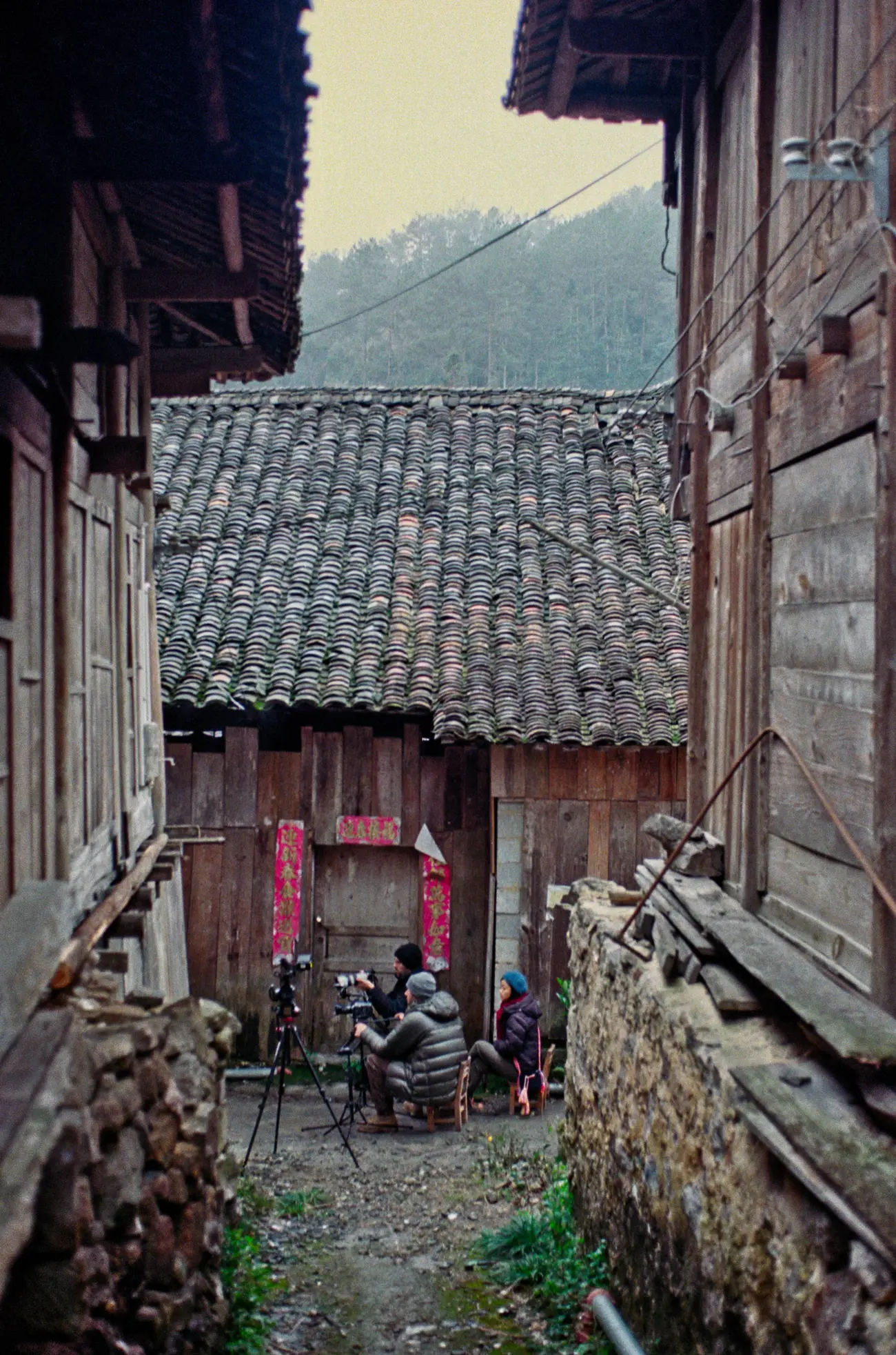 The crew film a cooking scene in the silent village.