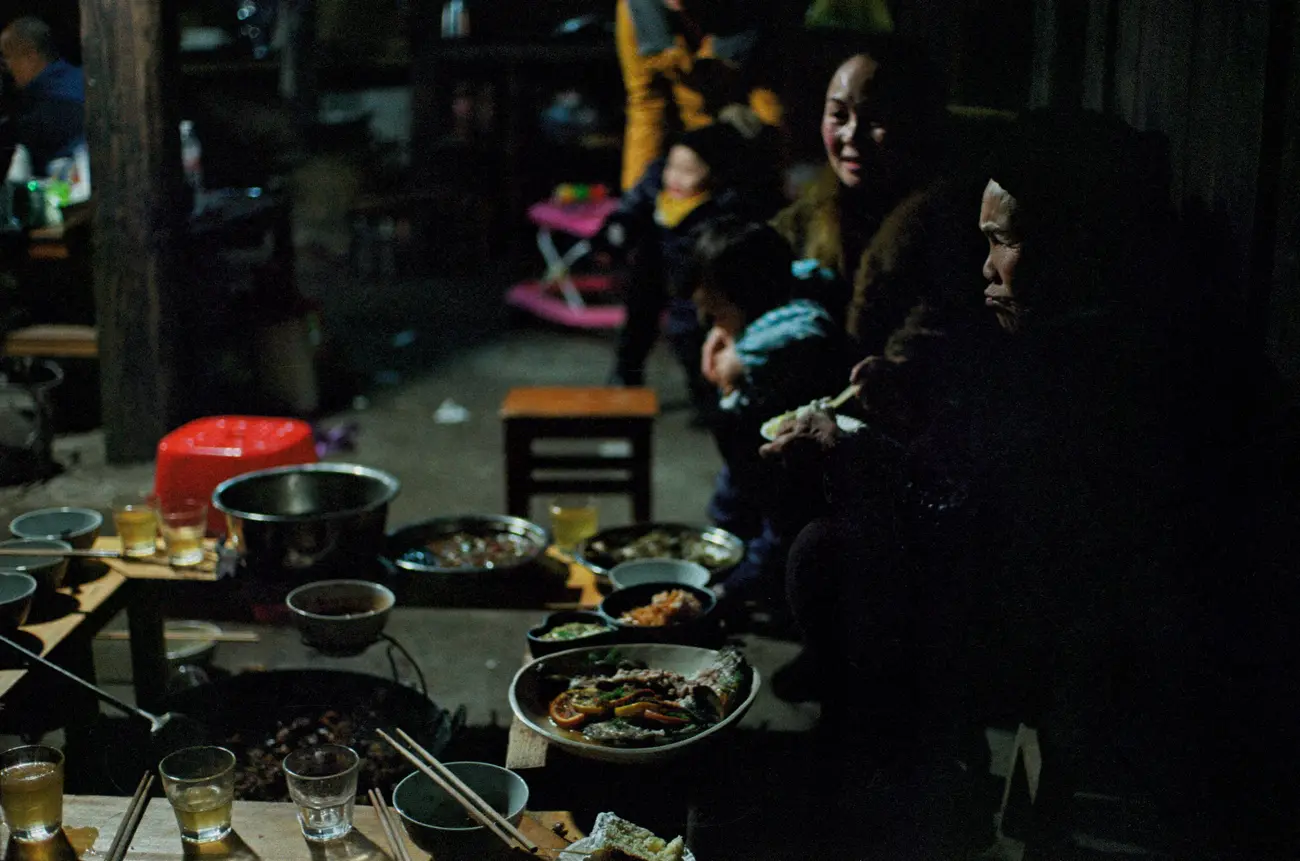 Meng-nainai cooks a feast for her grandchild's birthday.