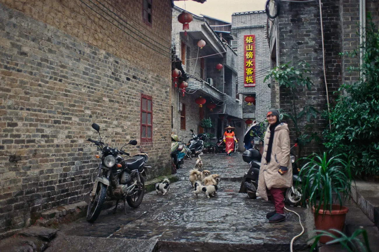 Mama dog's mama (guesthouse owner) taking the kids to town.